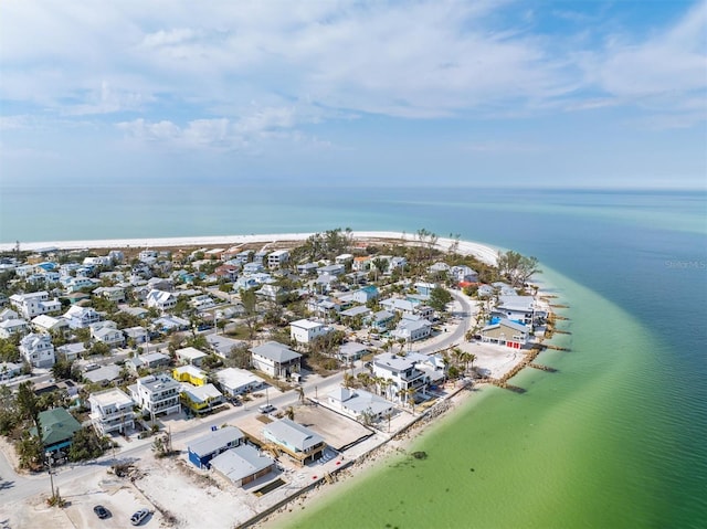 drone / aerial view featuring a water view and a view of the beach