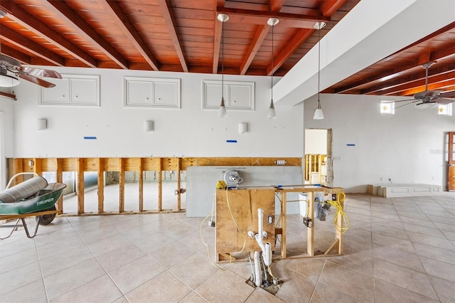 interior space with wood ceiling, ceiling fan, and light tile patterned floors