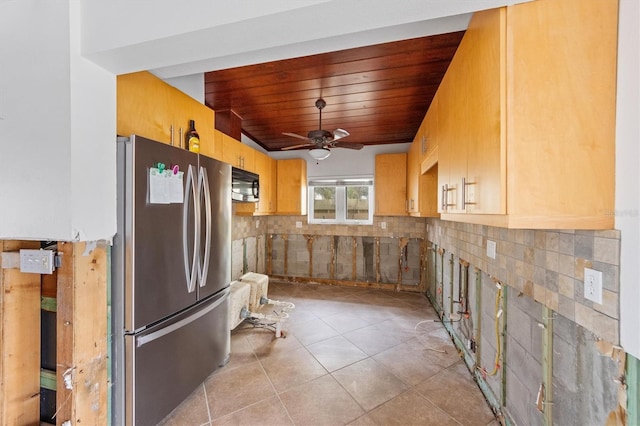 kitchen featuring wood ceiling, stainless steel refrigerator, ceiling fan, light tile patterned flooring, and decorative backsplash