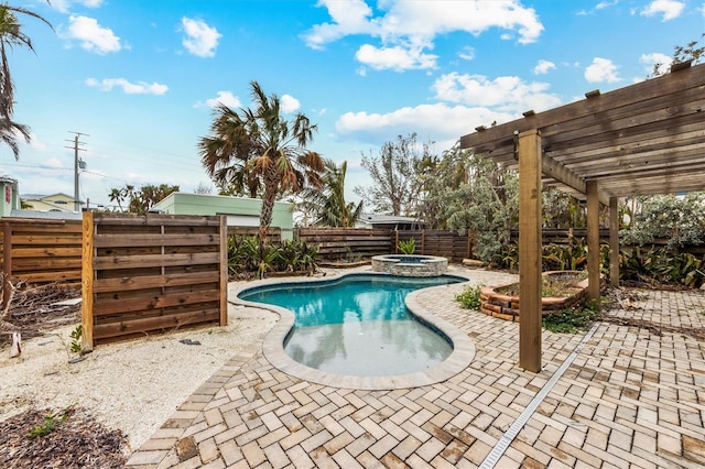 view of pool featuring an in ground hot tub, a patio area, and a pergola