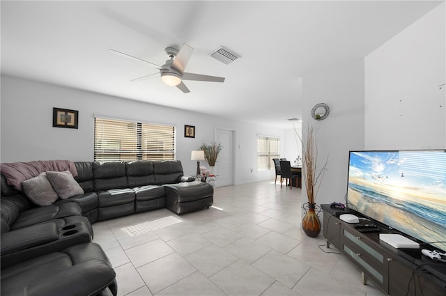 tiled living room featuring ceiling fan