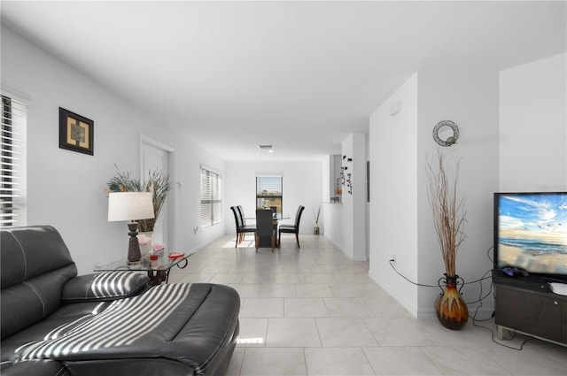 living room with light tile patterned flooring