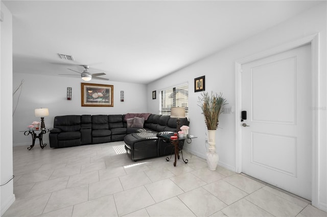 living room with ceiling fan and light tile patterned floors