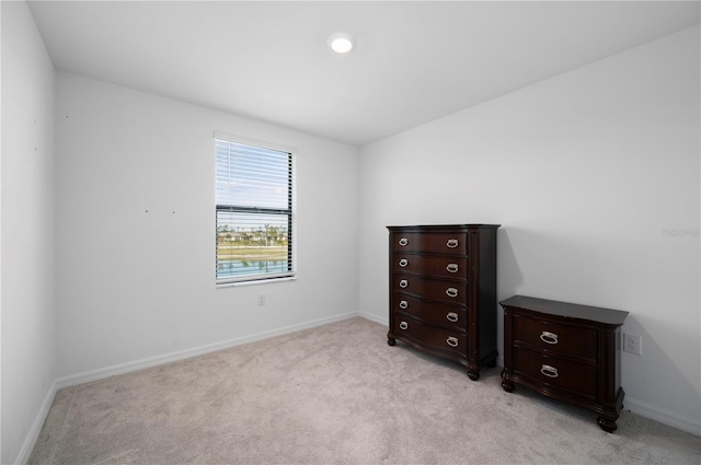 unfurnished bedroom with light carpet