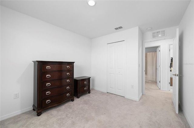 carpeted bedroom featuring a closet