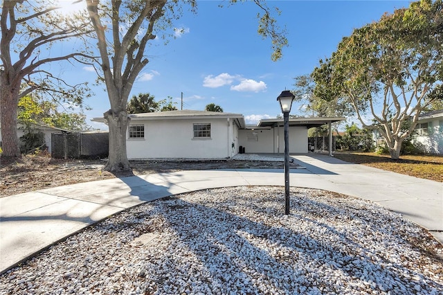 view of front of property featuring a carport