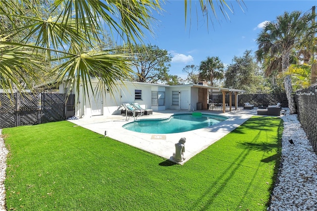 view of pool with a yard, an outdoor hangout area, and a patio