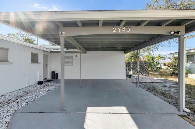 exterior space with a carport