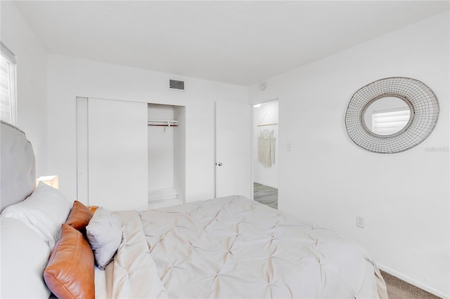 carpeted bedroom featuring a closet