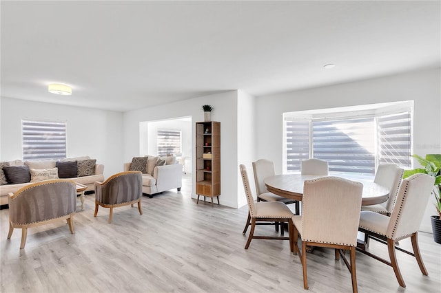 dining room featuring plenty of natural light and light hardwood / wood-style floors