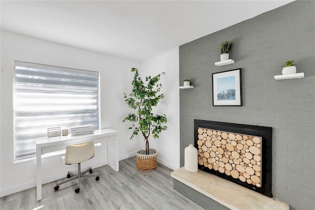 office area with light hardwood / wood-style flooring