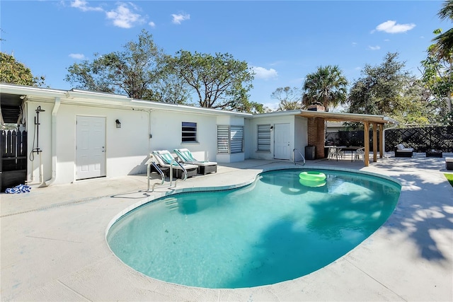 view of pool featuring a patio