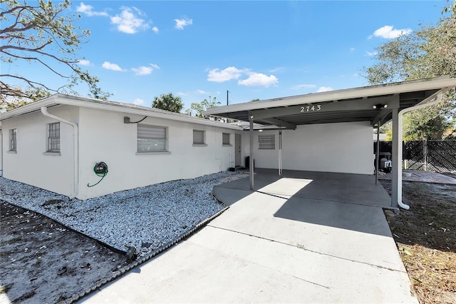 exterior space featuring a carport