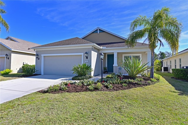 view of front of house featuring a garage and a front yard