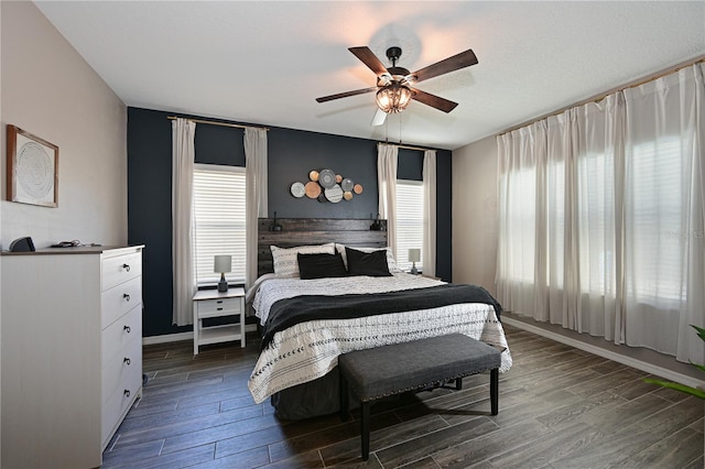 bedroom featuring ceiling fan and dark hardwood / wood-style flooring