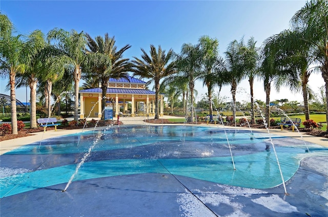 view of pool with pool water feature