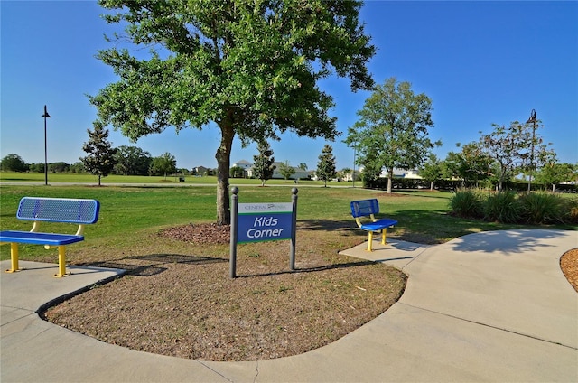 surrounding community featuring a lawn