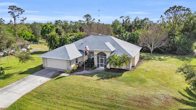 view of front of property featuring a garage and a front yard