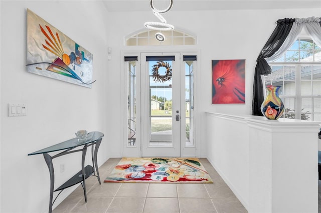 foyer entrance featuring light tile patterned floors