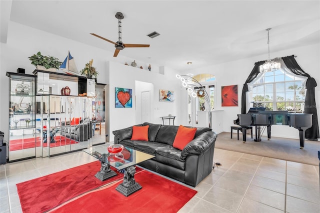 tiled living room featuring ceiling fan and a healthy amount of sunlight