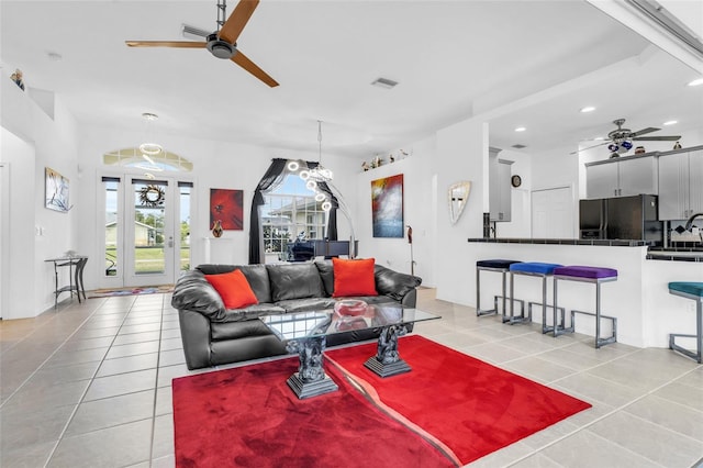 living room with sink, french doors, ceiling fan, and light tile patterned flooring