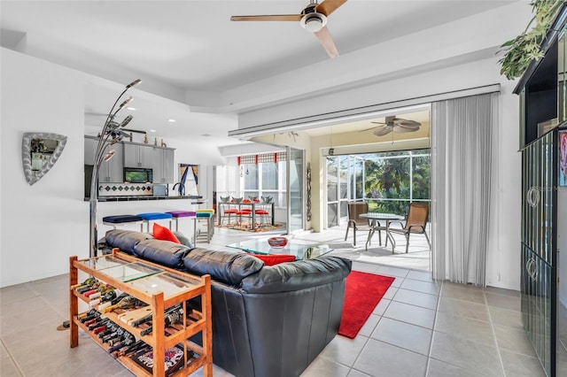 living room with light tile patterned flooring and ceiling fan