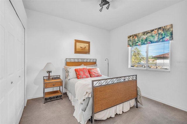 carpeted bedroom with a closet