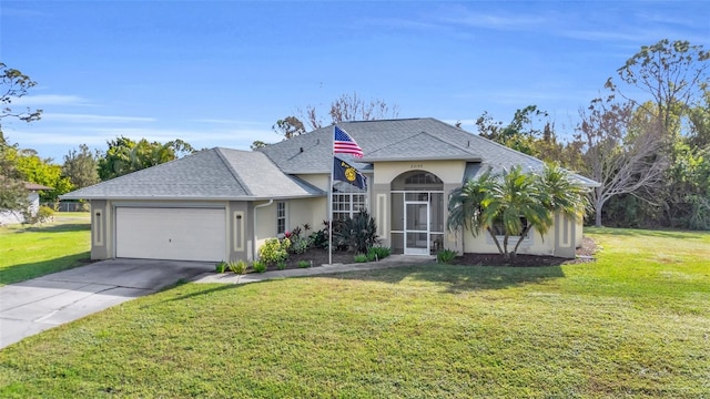 view of front of property with a garage and a front yard