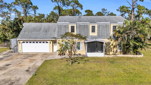 view of front facade featuring a garage, a sunroom, and a front yard