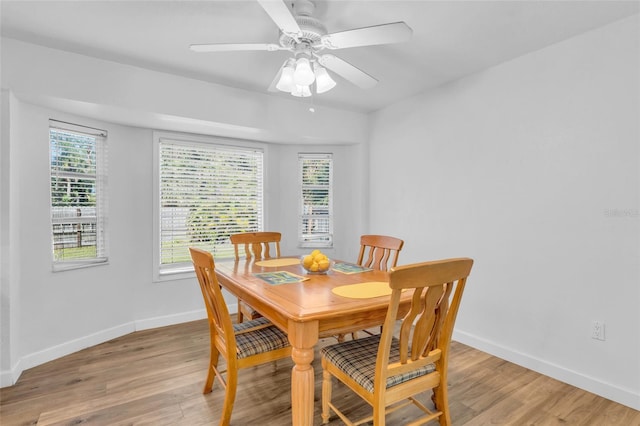 dining area featuring ceiling fan and light hardwood / wood-style floors