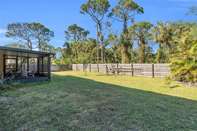 view of yard with a sunroom