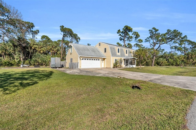 front facade with a garage and a front yard