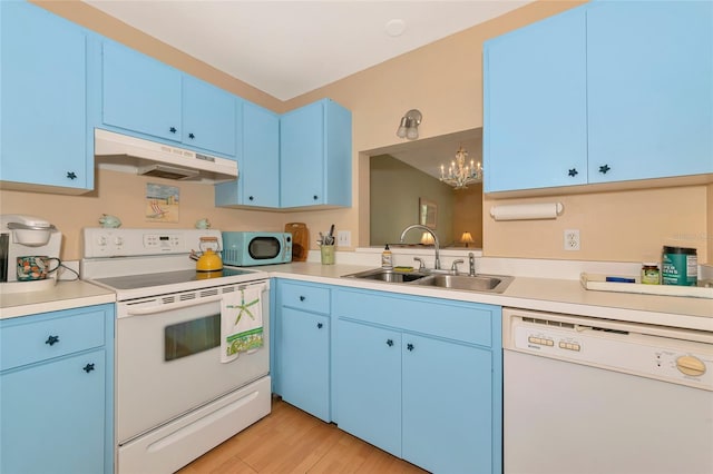 kitchen featuring blue cabinets, sink, light wood-type flooring, hanging light fixtures, and white appliances