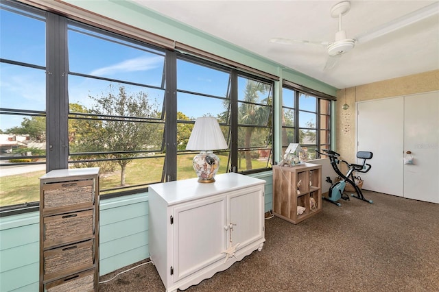 sunroom / solarium with ceiling fan