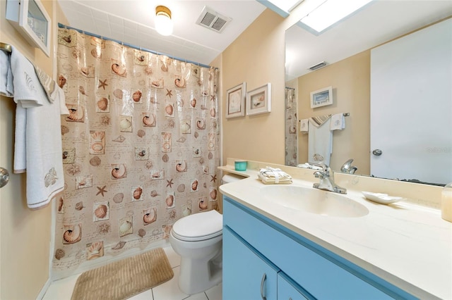 bathroom with tile patterned flooring, vanity, curtained shower, and toilet