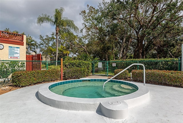 view of pool featuring a hot tub