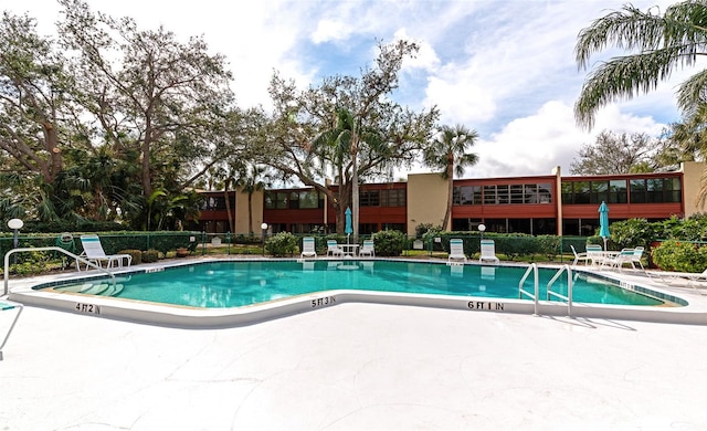 view of swimming pool featuring a patio