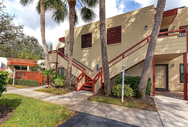 535 Spring Lakes Blvd, Bradenton, FL 34210 - view of front facade with stucco siding and stairway