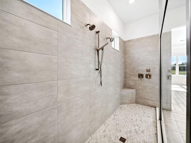 bathroom with tiled shower