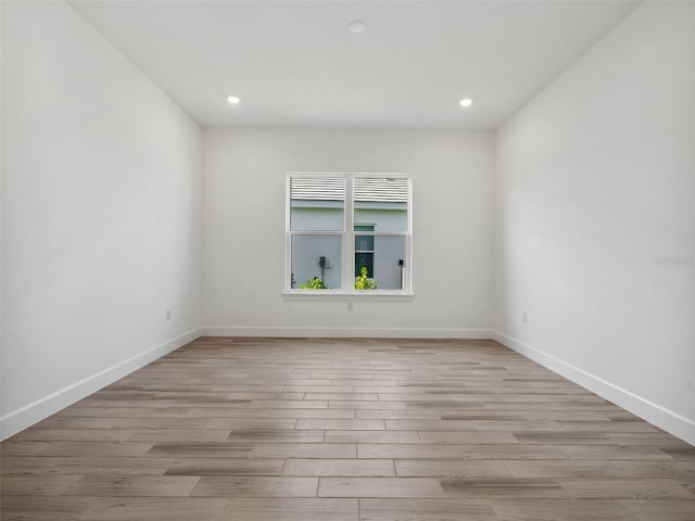 unfurnished room featuring light hardwood / wood-style floors