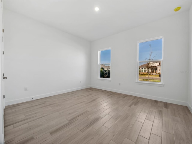 unfurnished room featuring light hardwood / wood-style floors