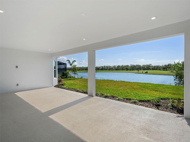 view of patio with a water view