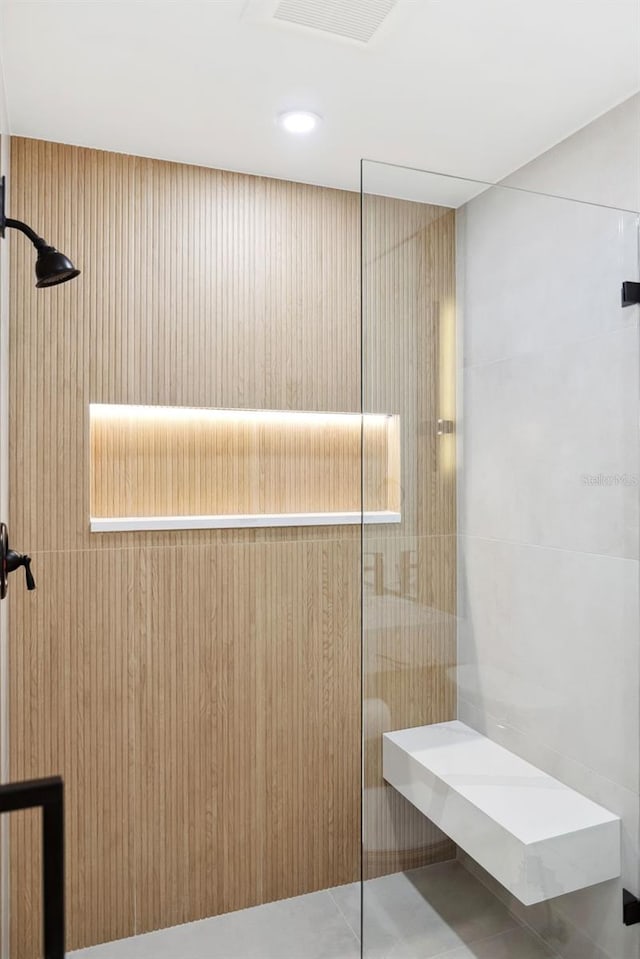 bathroom featuring tile patterned floors and a shower