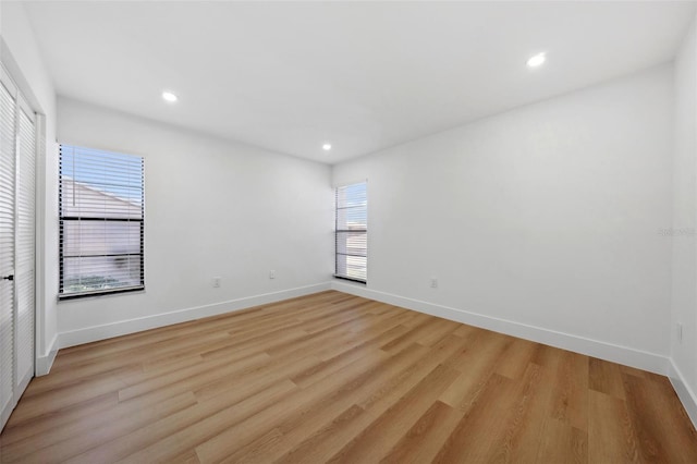 empty room with light hardwood / wood-style floors