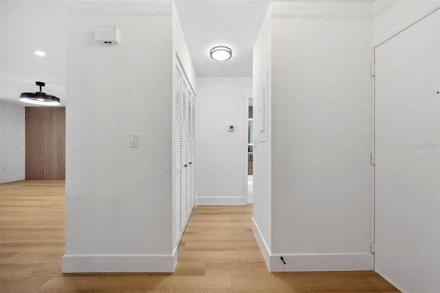 hall with light hardwood / wood-style floors