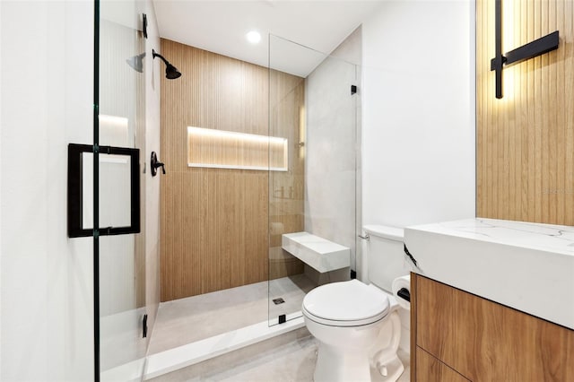 bathroom with vanity, toilet, and walk in shower