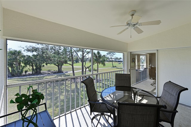 exterior space with vaulted ceiling and ceiling fan