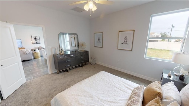 carpeted bedroom with ceiling fan