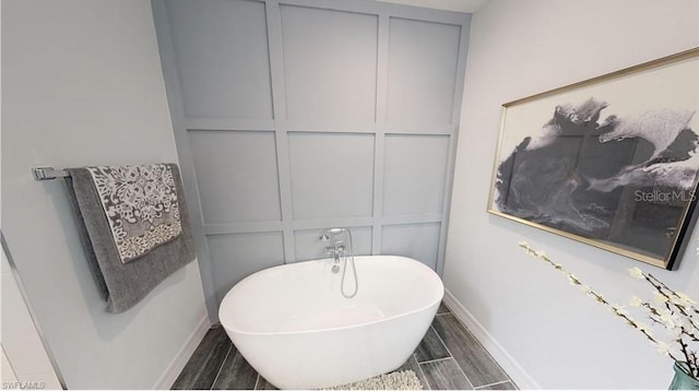 bathroom featuring a tub to relax in