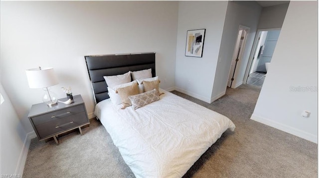 bedroom featuring light colored carpet